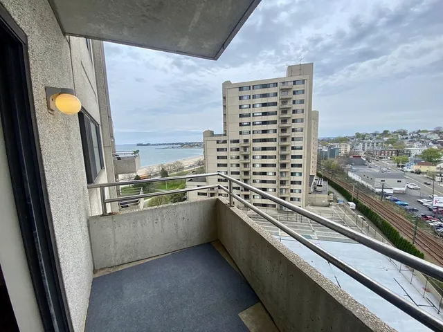 a kitchen with stainless steel appliances a sink and a large window