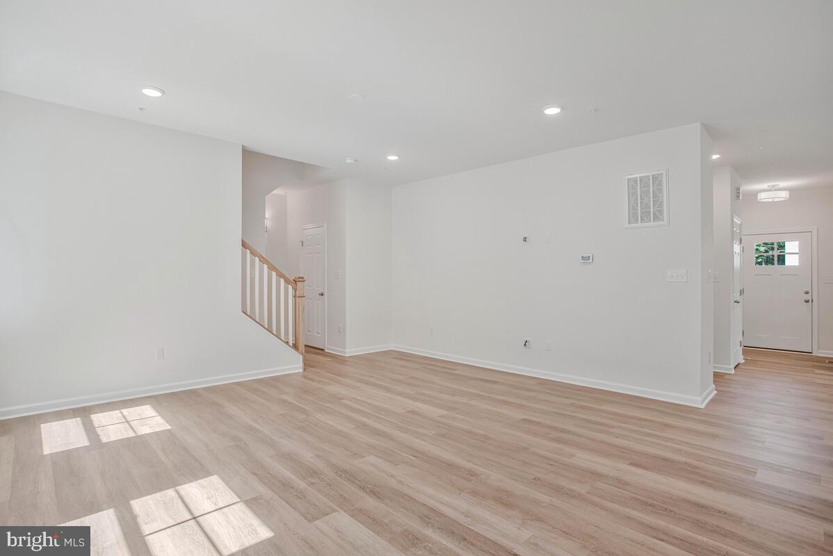 404 Warwick Place Edgewater, MD 21037 - Photo 14 of 76 an empty room with wooden floor