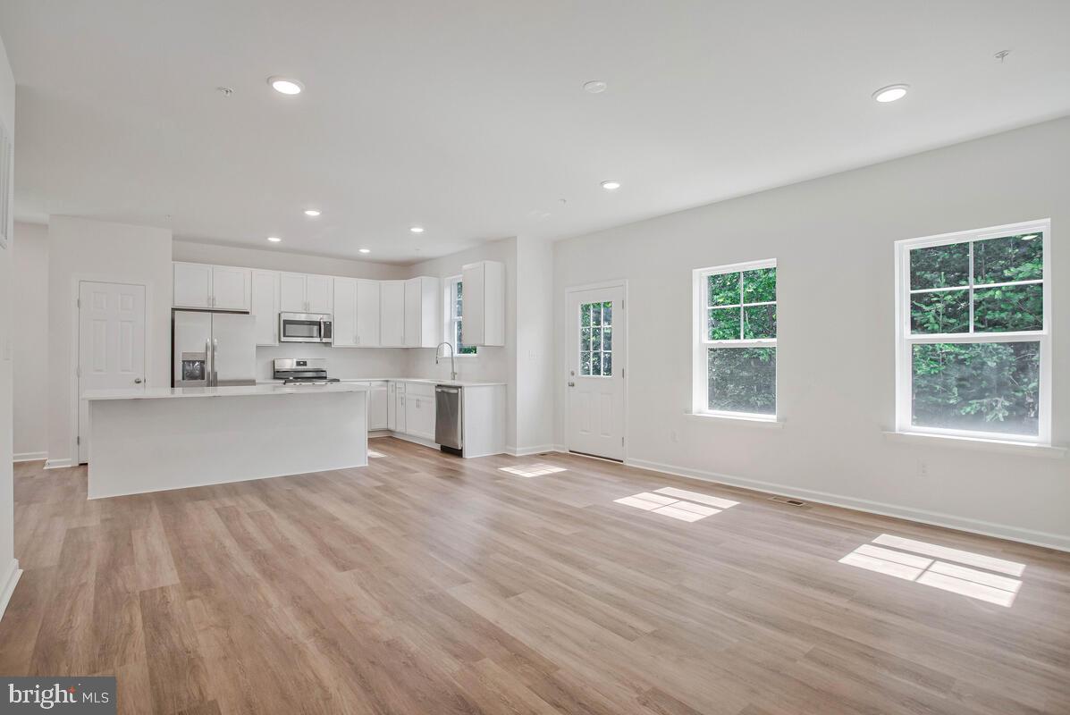 404 Warwick Place Edgewater, MD 21037 - Photo 15 of 76 a view of kitchen with wooden floor and window