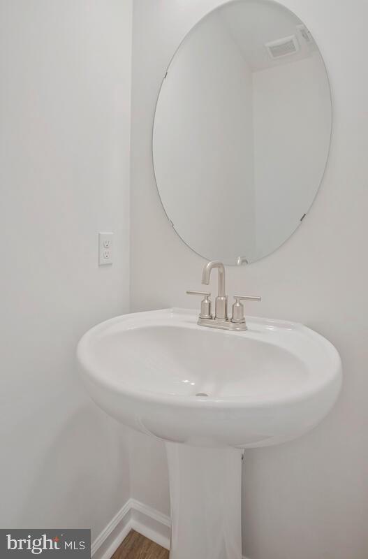 404 Warwick Place Edgewater, MD 21037 - Photo 18 of 76 a bathroom with a sink
