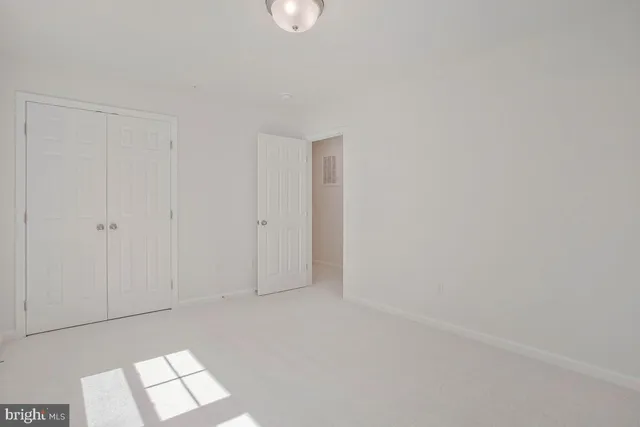 a bathroom with a sink toilet and a mirror
