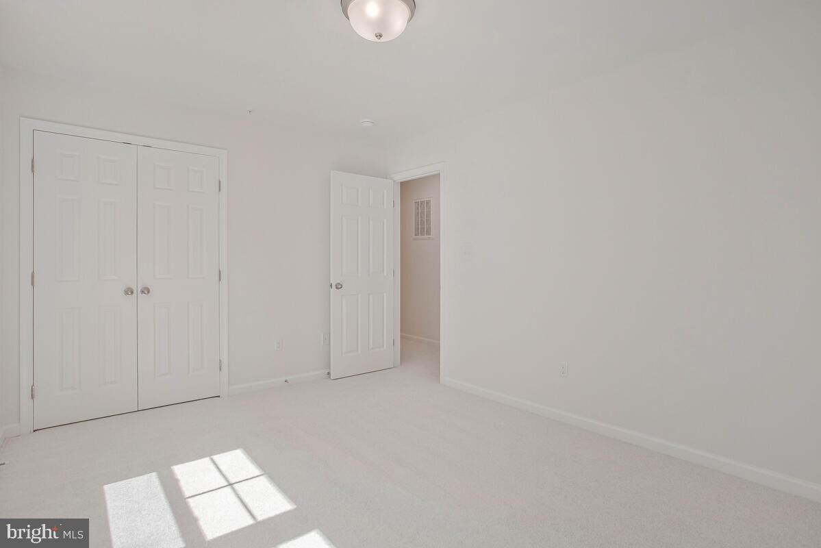 404 Warwick Place Edgewater, MD 21037 - Photo 22 of 76 a view of an empty room and a window