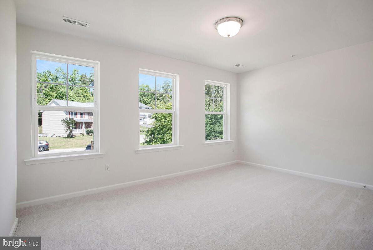 404 Warwick Place Edgewater, MD 21037 - Photo 23 of 76 an empty room with windows