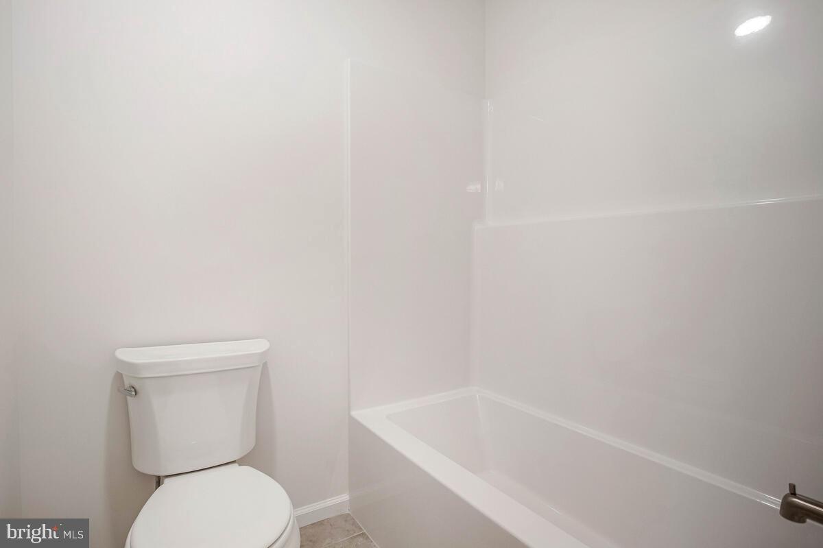 404 Warwick Place Edgewater, MD 21037 - Photo 26 of 76 a white toilet sitting next to a white sink