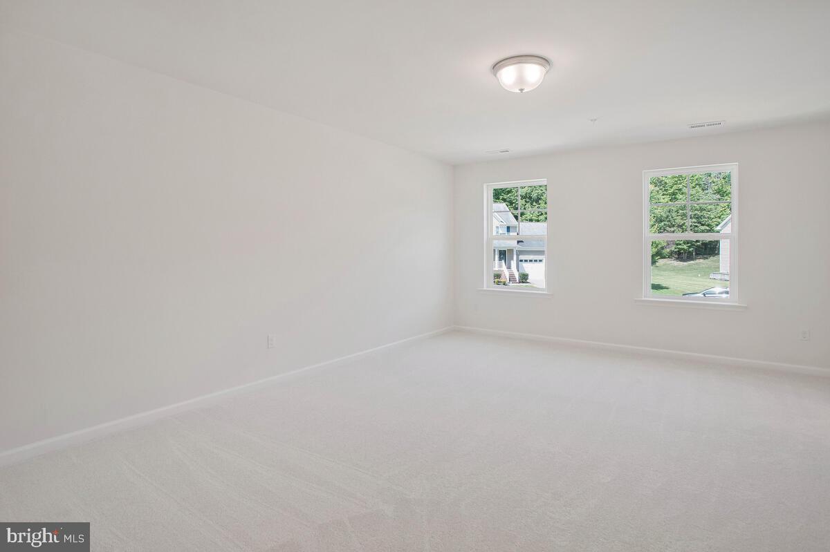 404 Warwick Place Edgewater, MD 21037 - Photo 27 of 76 an empty room with windows