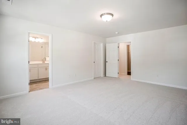a bathroom with double sink and a mirror
