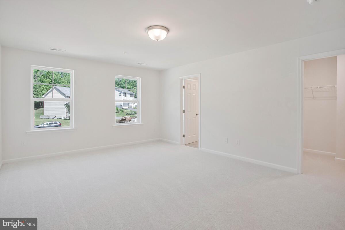 404 Warwick Place Edgewater, MD 21037 - Photo 29 of 76 an empty room with windows