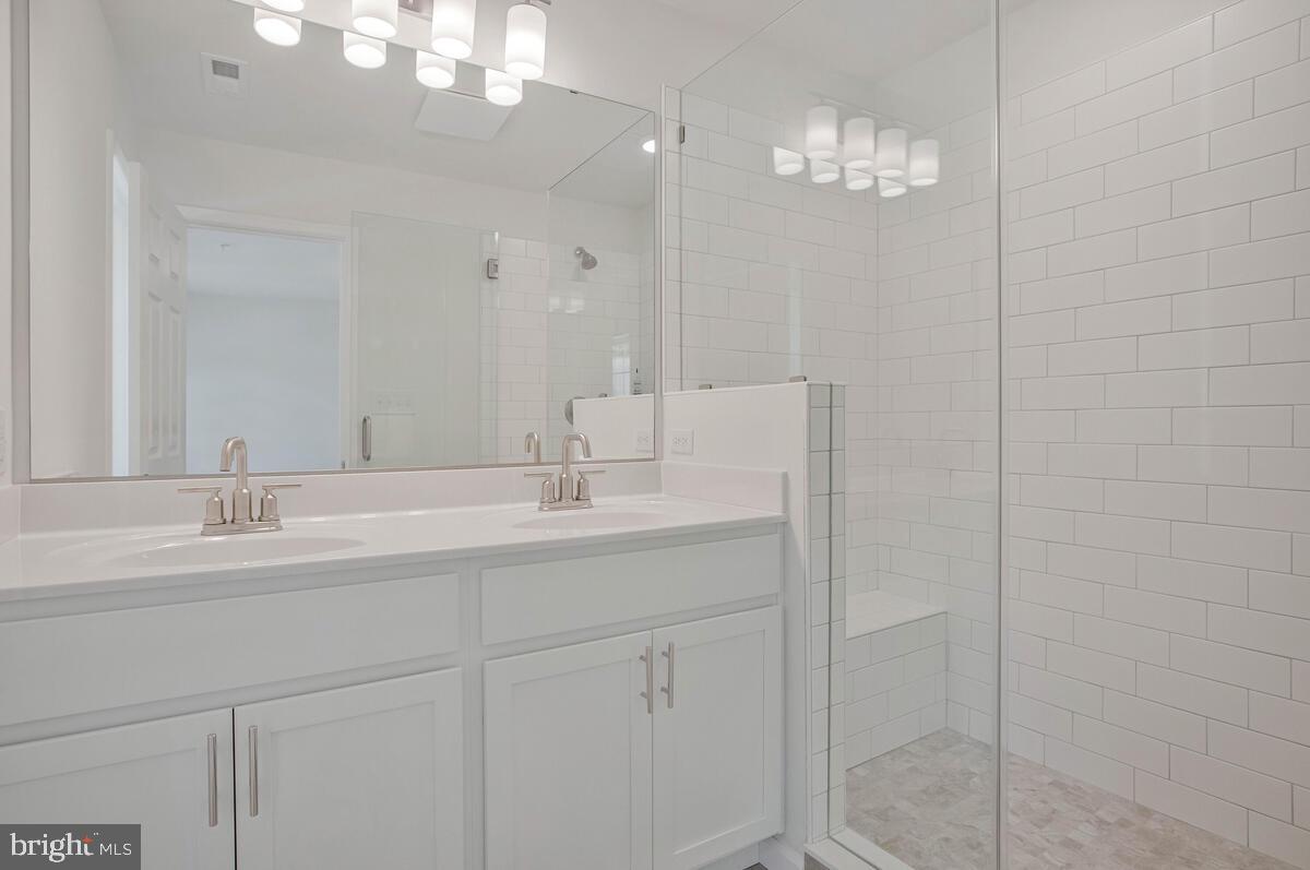 404 Warwick Place Edgewater, MD 21037 - Photo 30 of 76 a bathroom with a sink and a mirror