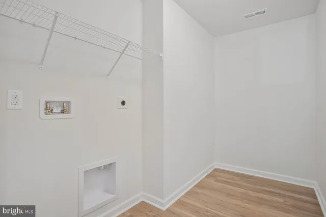 a backyard of a house with lots of green space and fountain