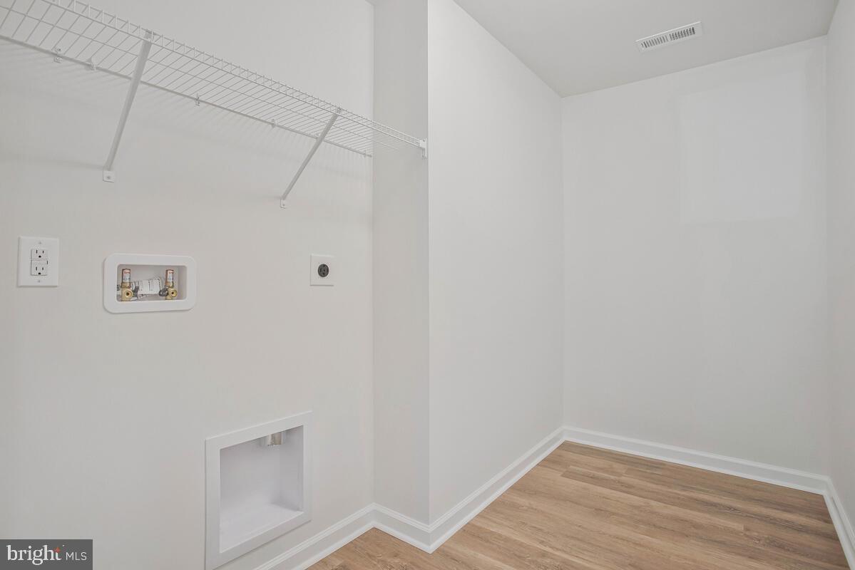 404 Warwick Place Edgewater, MD 21037 - Photo 34 of 76 a view of small space with empty racks