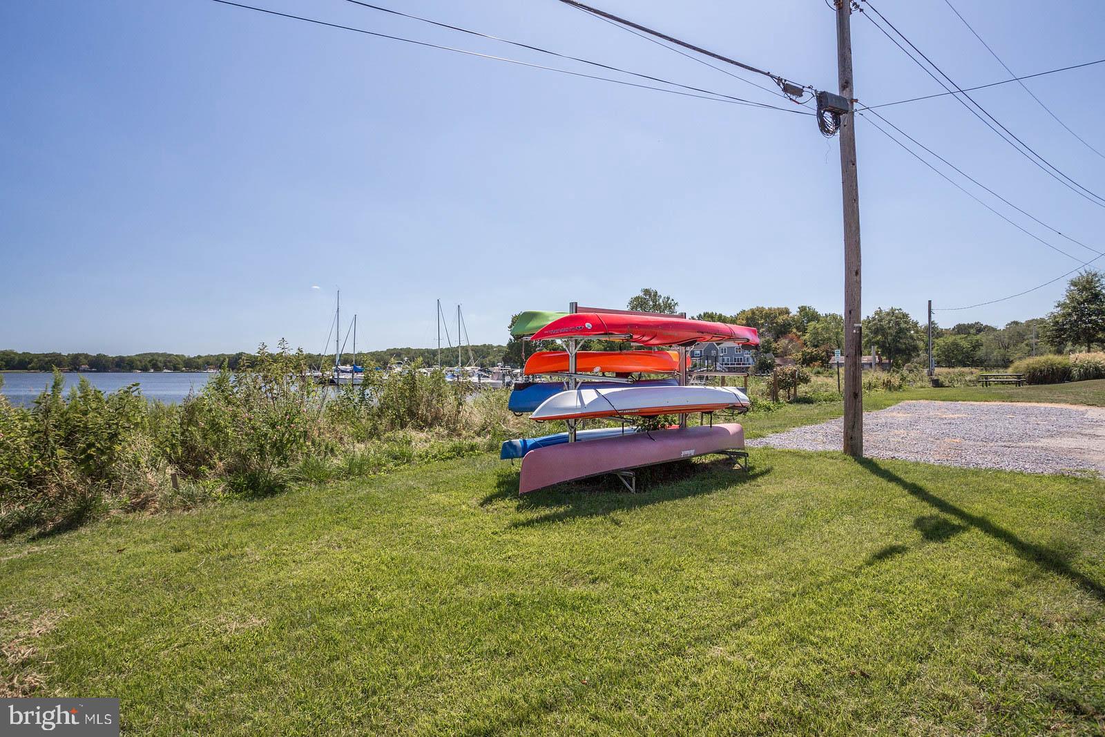 404 Warwick Place Edgewater, MD 21037 - Photo 44 of 76 a backyard of a house with lots of green space and fountain