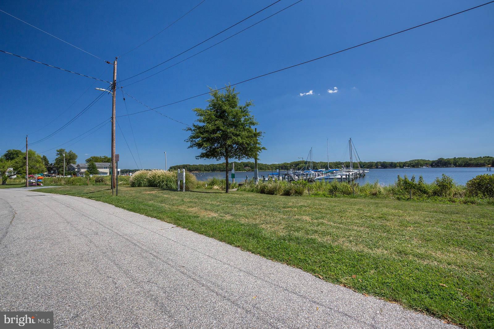 404 Warwick Place Edgewater, MD 21037 - Photo 48 of 76 a view of a golf course with a lake view
