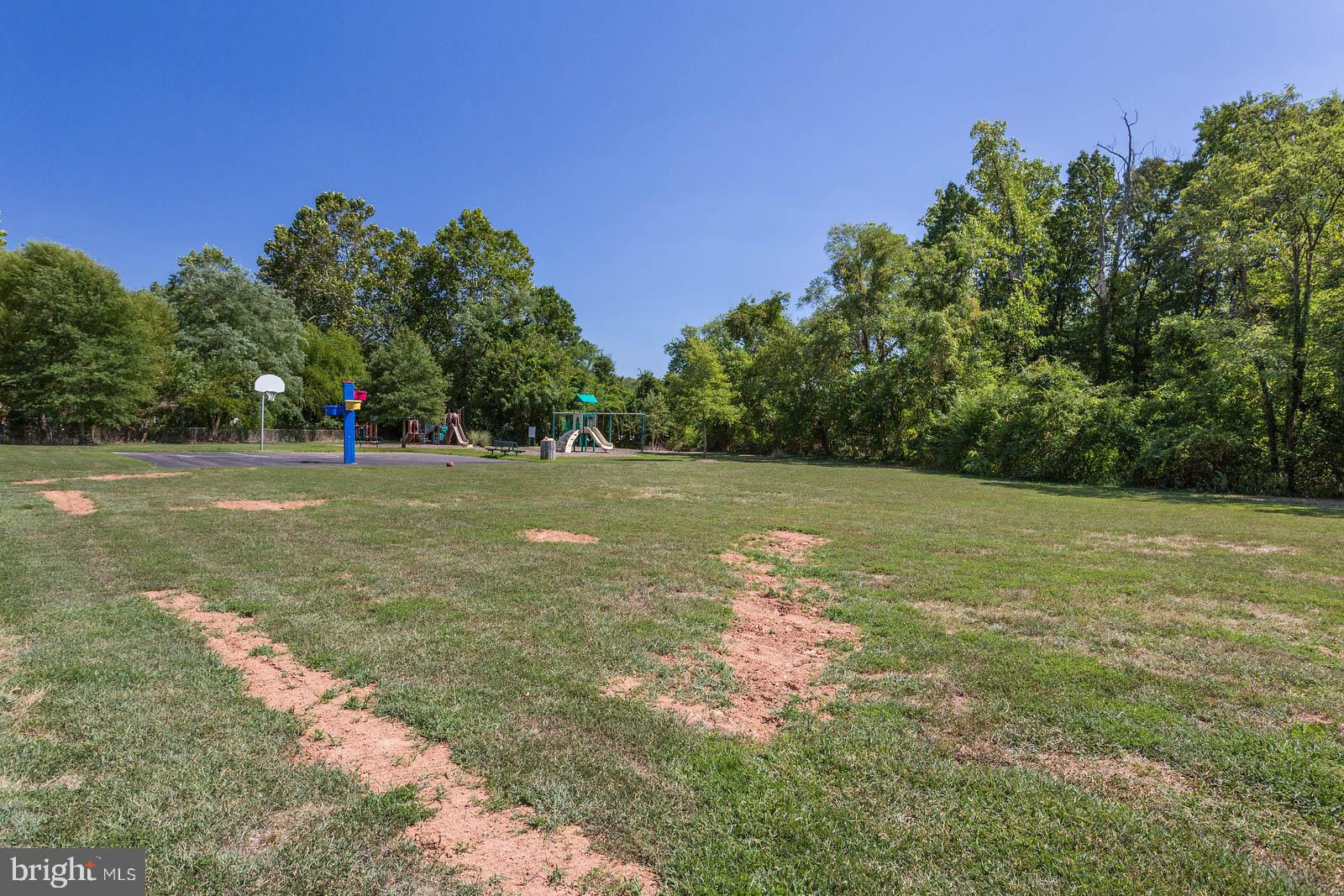 404 Warwick Place Edgewater, MD 21037 - Photo 54 of 76 a view of a field with trees in the background
