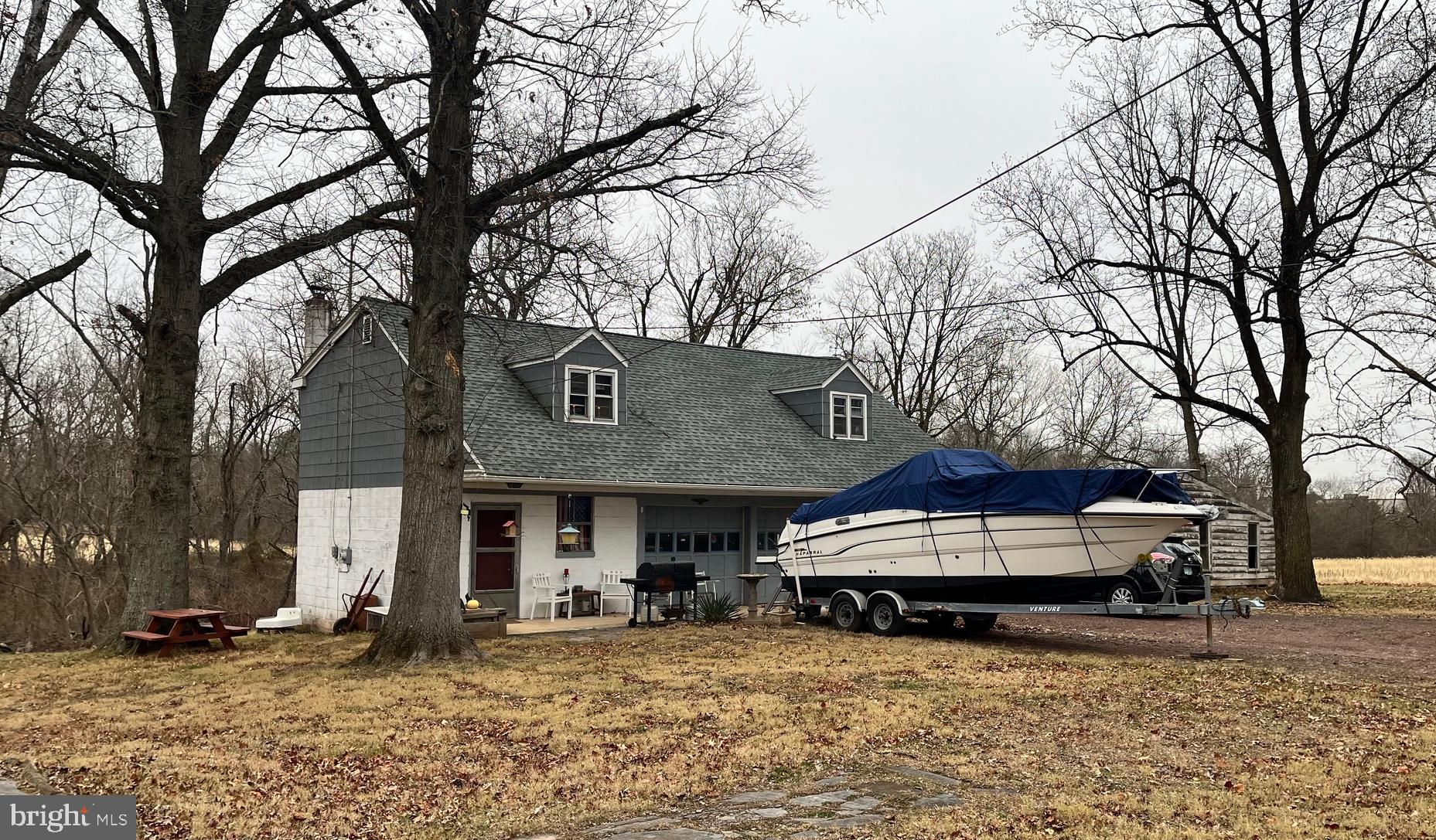 4595 County Line Road Line Lexington, PA 18914 - Photo 5 of 12 a view of a house with a large tree in front of it