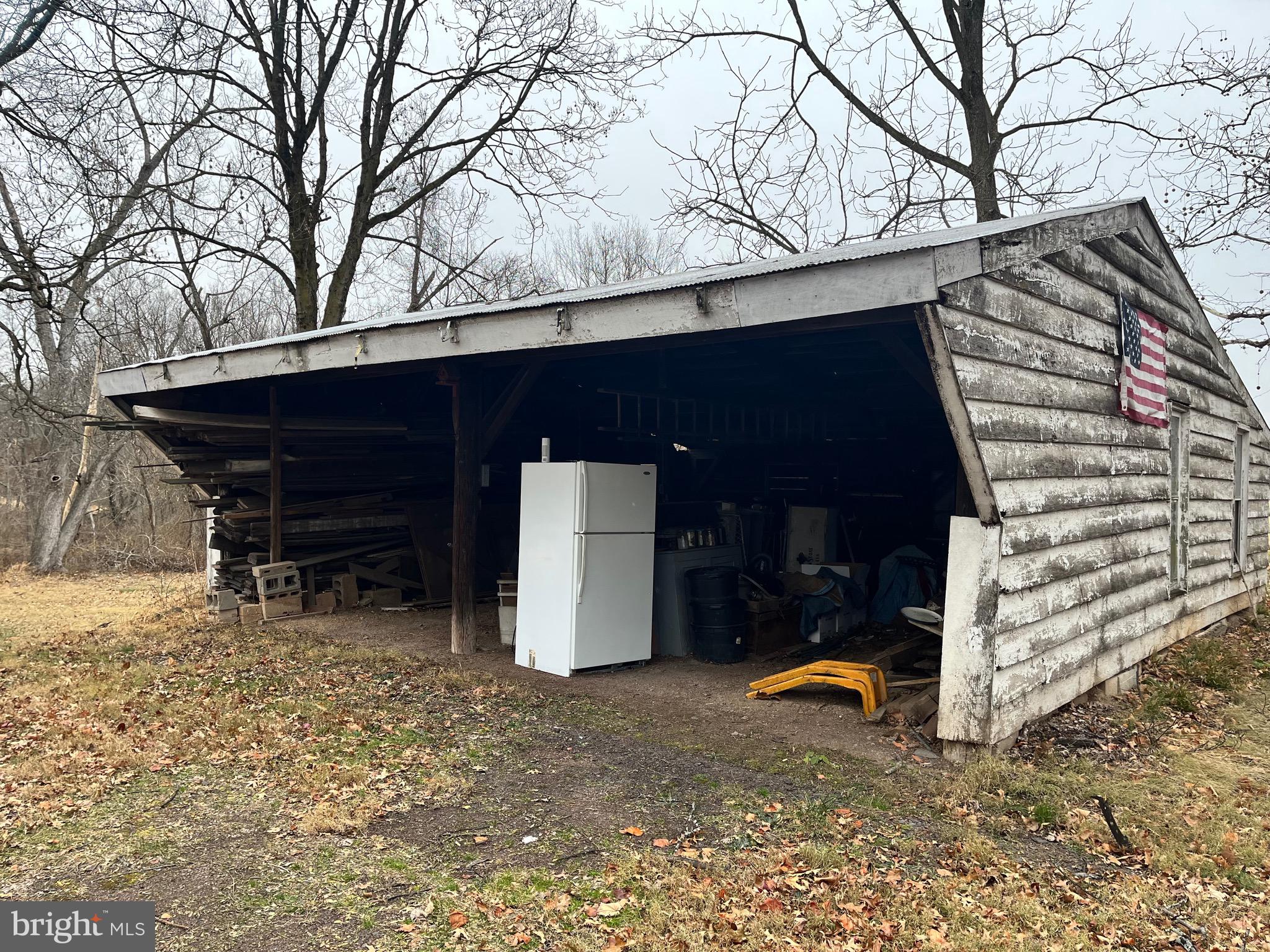 4595 County Line Road Line Lexington, PA 18914 - Photo 6 of 12 a view of backyard with cabin