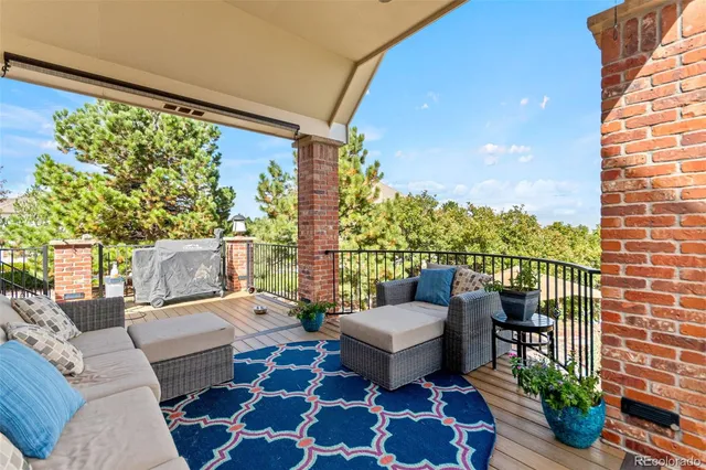 a balcony with furniture and rug