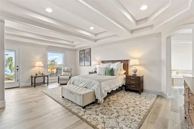 a spacious bedroom with a bed and window