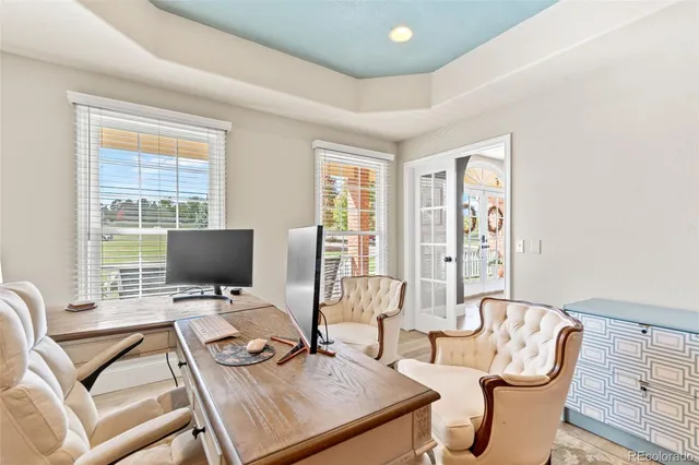 a work room with furniture and wooden floor