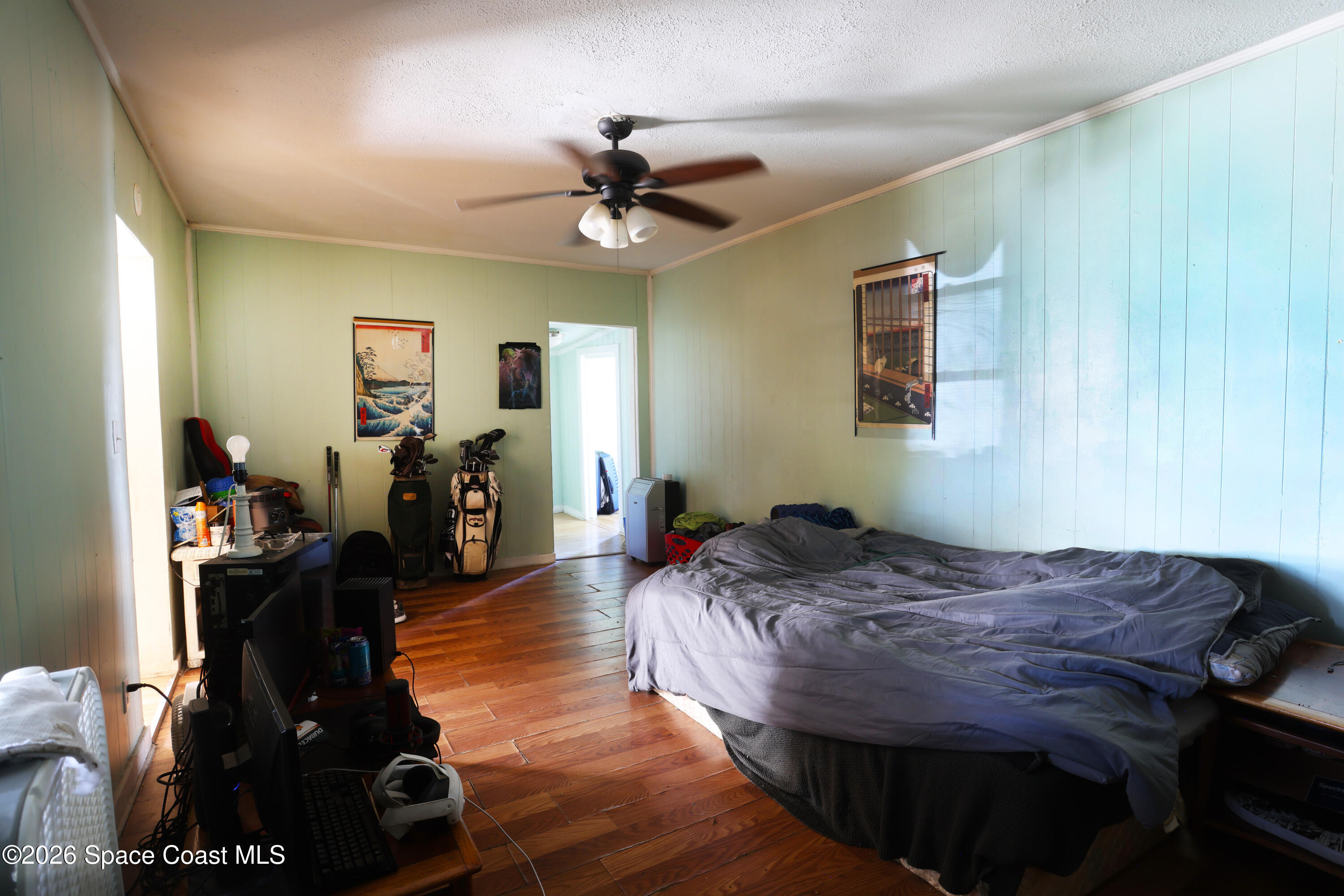 317 Pineda Street, Unit B Cocoa, FL 32922 - Photo 12 of 19 a bedroom with a bed and wooden floor