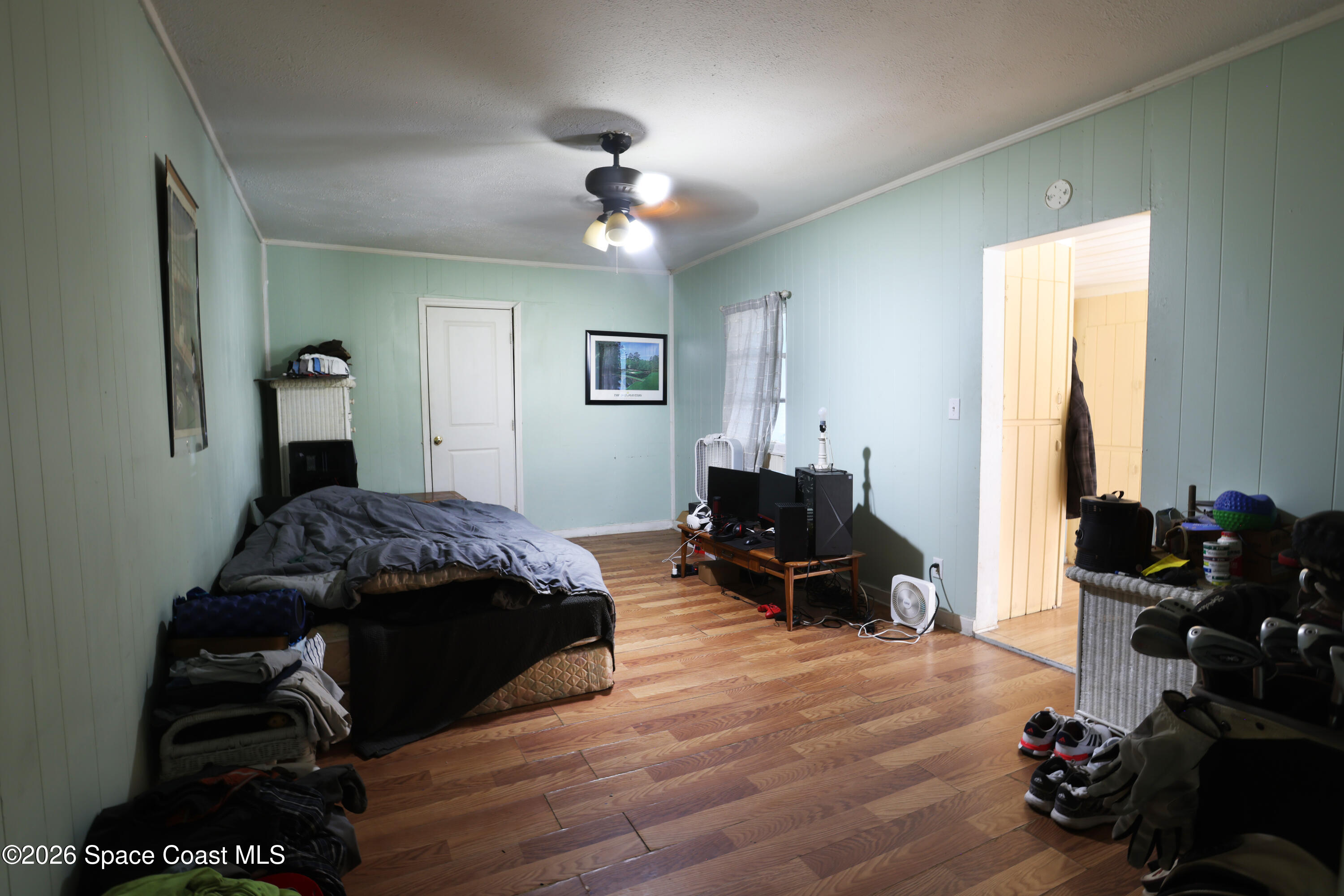 317 Pineda Street, Unit B Cocoa, FL 32922 - Photo 13 of 19 a bedroom that has a bed and wooden floor