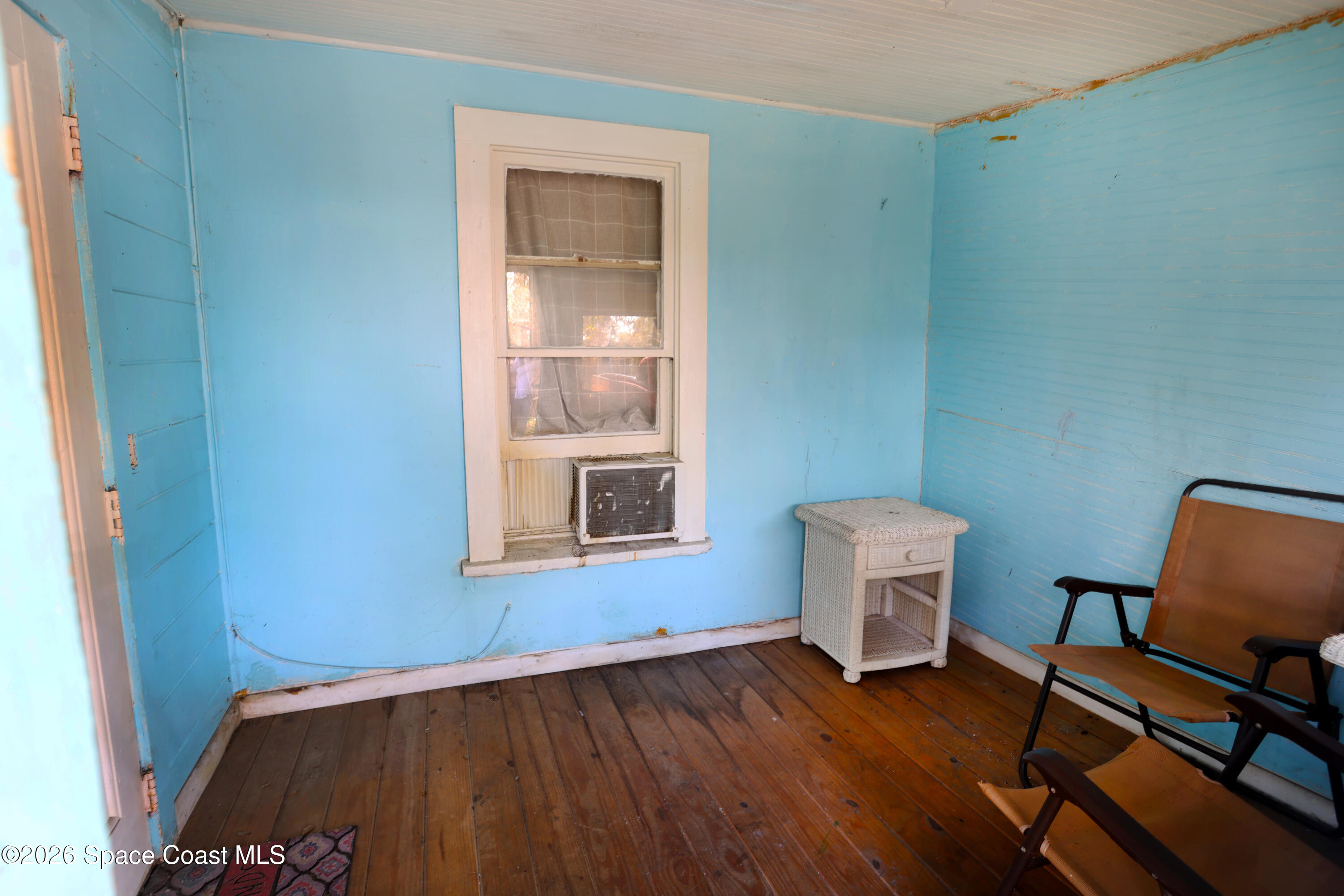 317 Pineda Street, Unit B Cocoa, FL 32922 - Photo 18 of 19 a view of workspace with wooden floor and chair