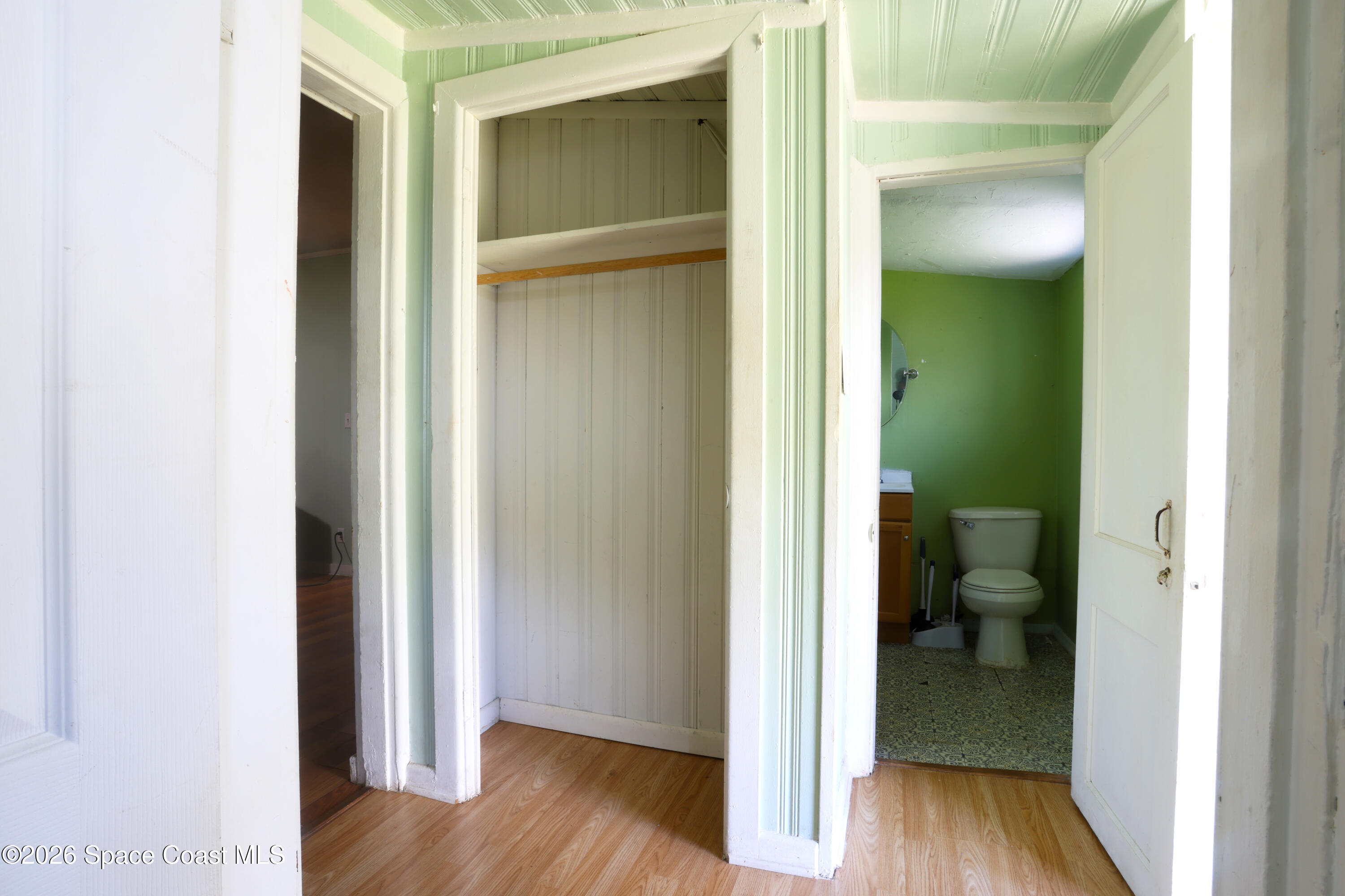 317 Pineda Street, Unit B Cocoa, FL 32922 - Photo 5 of 19 a view of a bathroom from a hallway with toilet