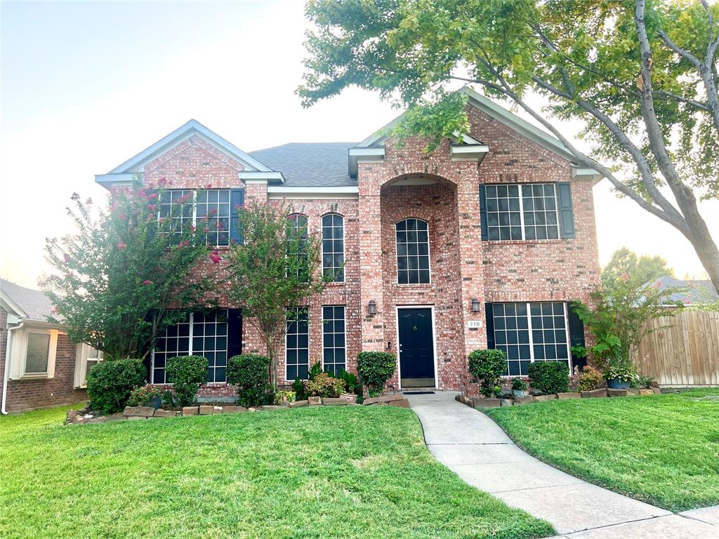 770 Whitman Drive Allen, TX 75002 - Photo 2 of 38 a front view of a house with a yard and garage