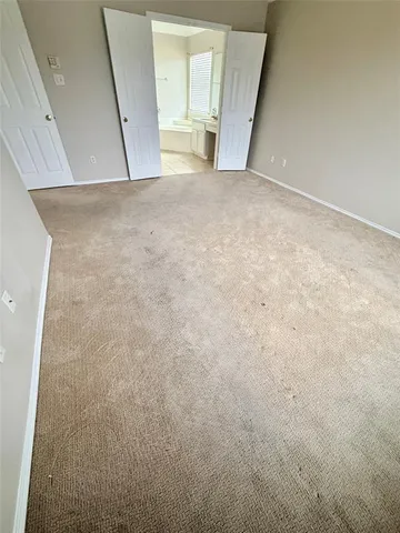 a view of a room with wooden floor and stairs