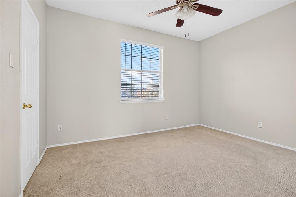 770 Whitman Drive Allen, TX 75002 - Photo 27 of 38 an empty room with a window and a ceiling fan
