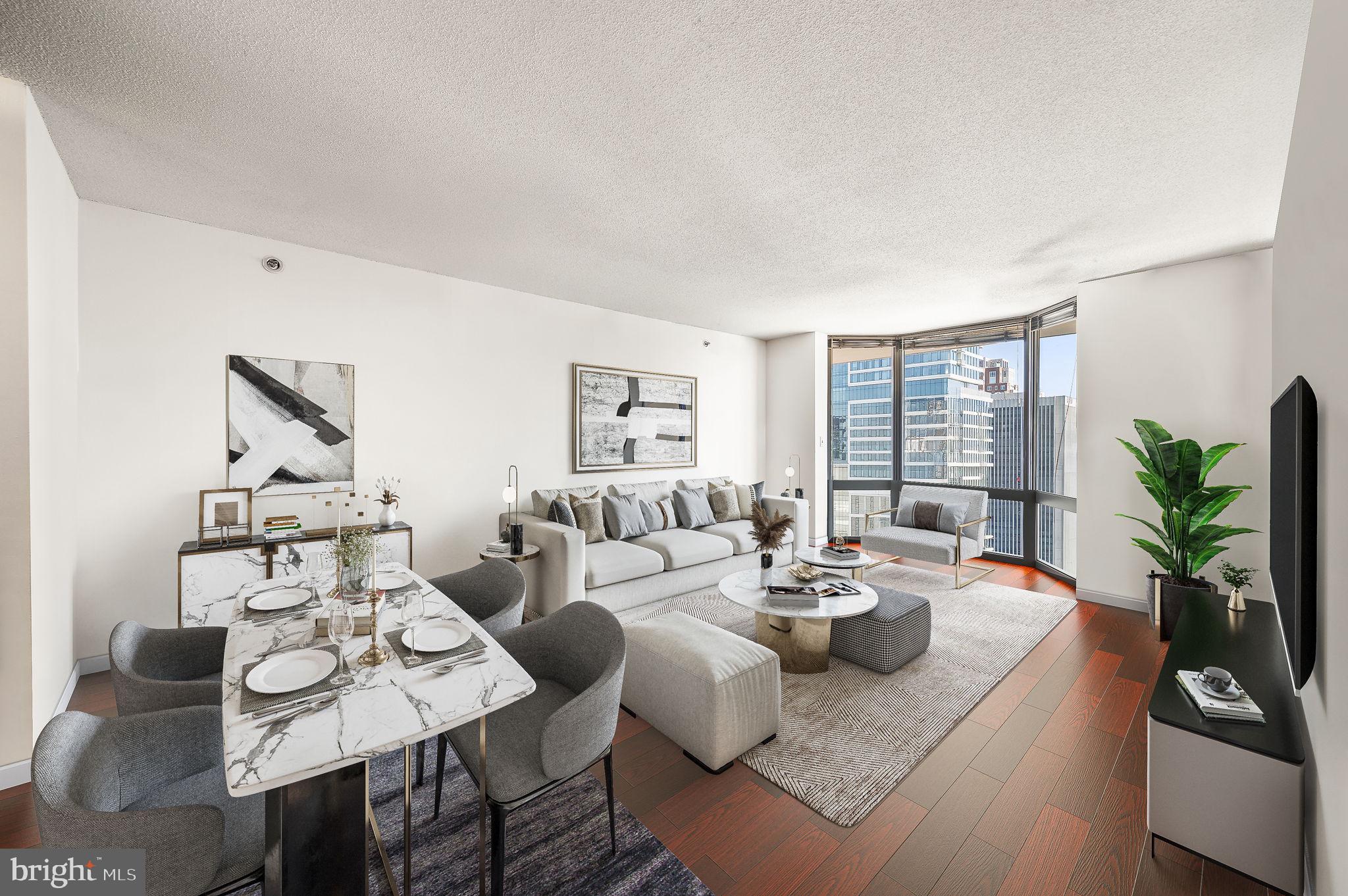 a living room with fireplace furniture and a potted plant