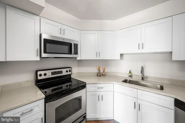 a bedroom with bed and large windows