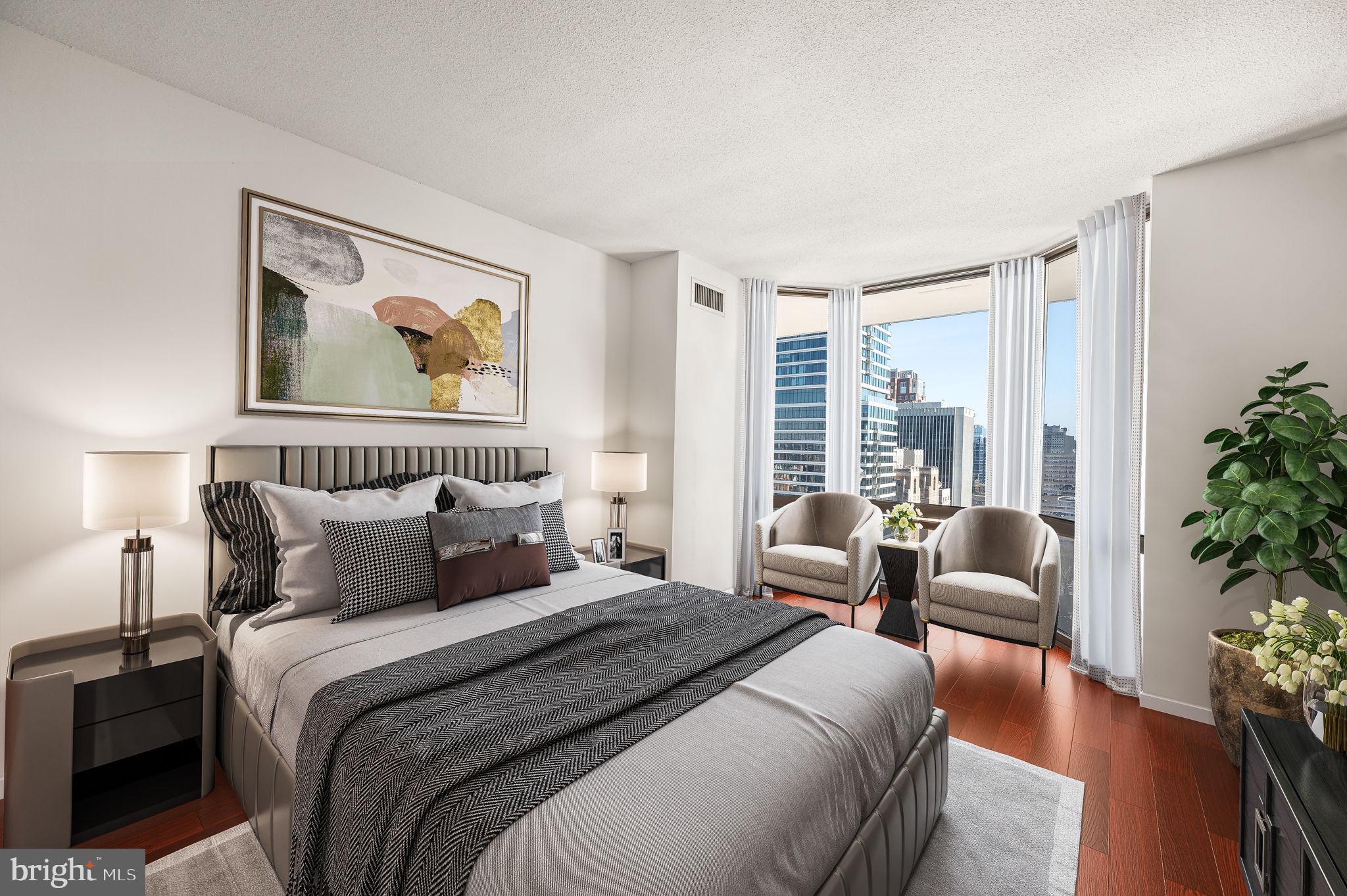 2020 Walnut Street, Unit 29D Philadelphia, PA 19103 - Photo 12 of 40 a bedroom with bed and large windows