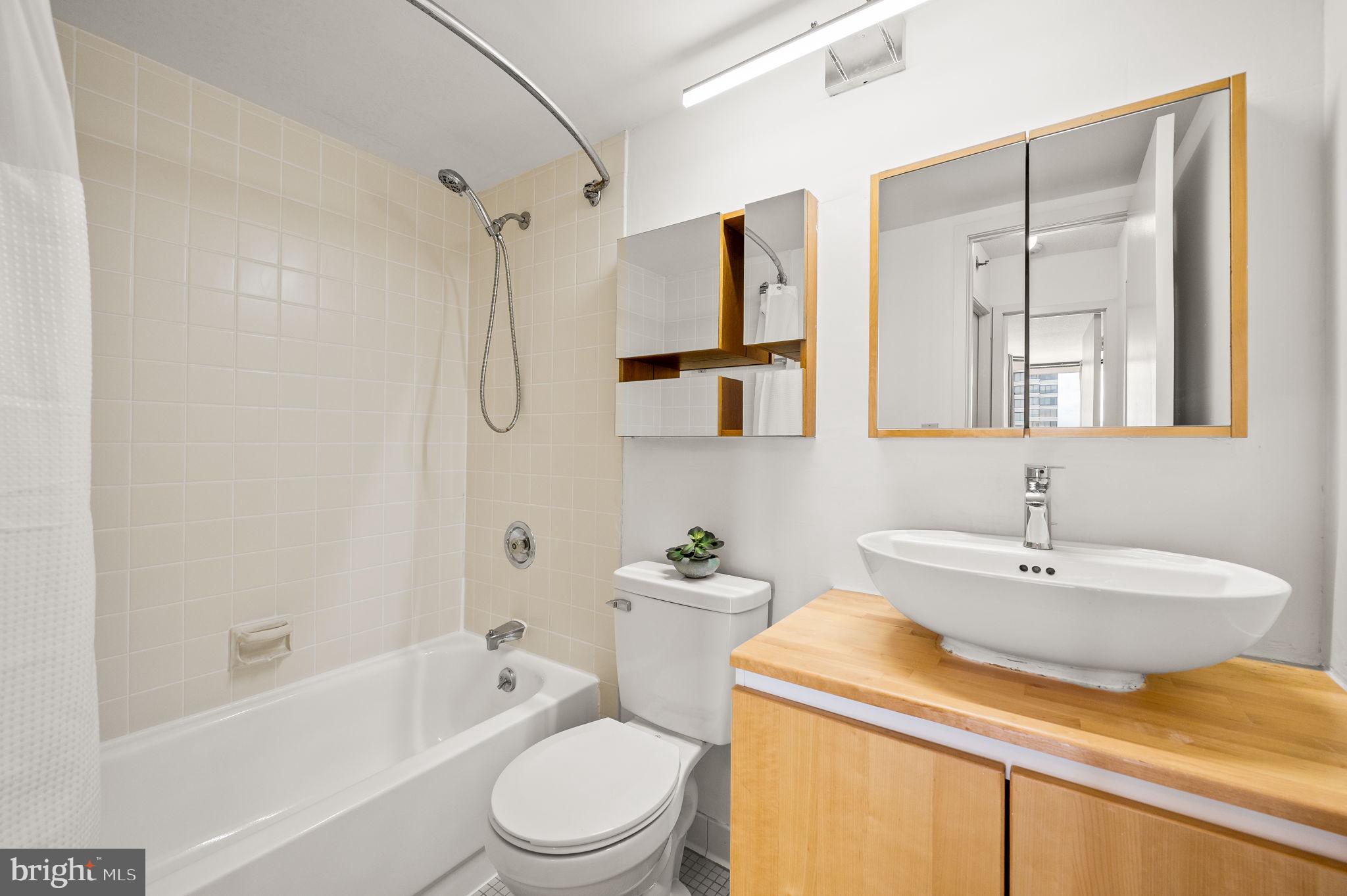 2020 Walnut Street, Unit 29D Philadelphia, PA 19103 - Photo 15 of 40 a bathroom with a sink a toilet and shower
