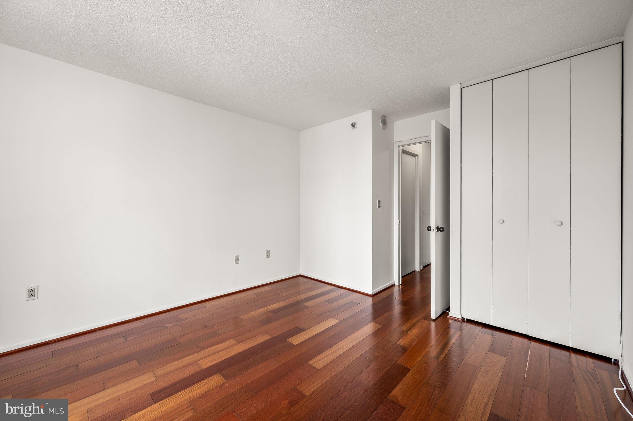 2020 Walnut Street, Unit 29D Philadelphia, PA 19103 - Photo 17 of 40 a view of an empty room with wooden floor