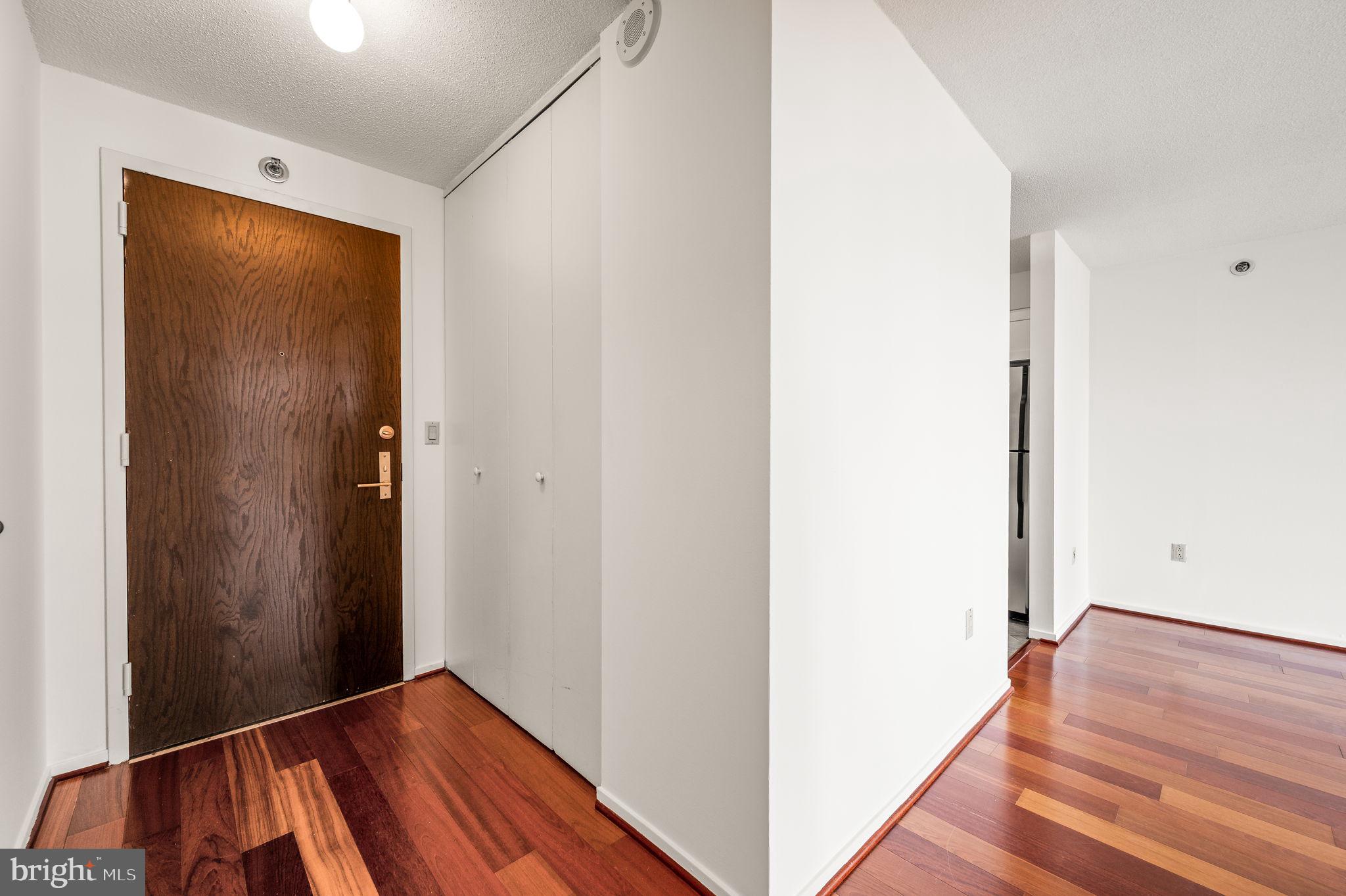 2020 Walnut Street, Unit 29D Philadelphia, PA 19103 - Photo 18 of 40 a view of a hallway with wooden floor