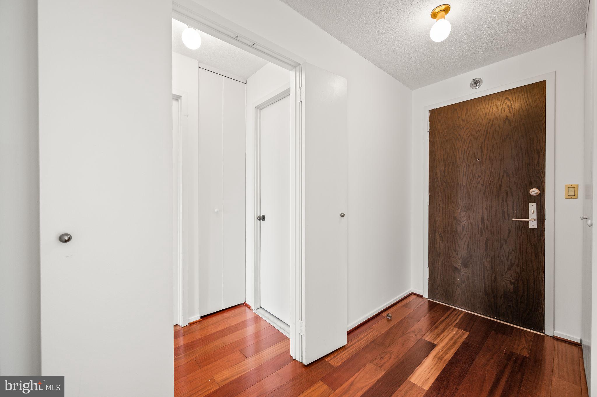 2020 Walnut Street, Unit 29D Philadelphia, PA 19103 - Photo 19 of 40 a view of an empty room with wooden floor and closet