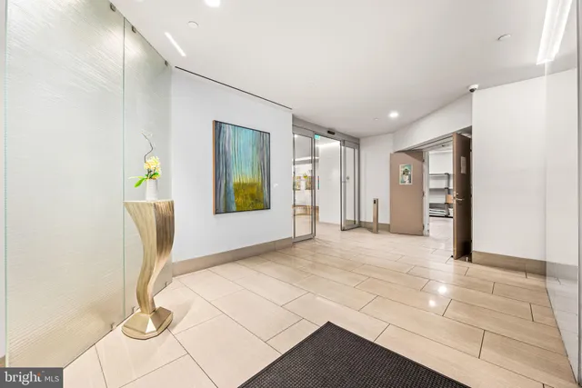 a view of an entryway with wooden floor