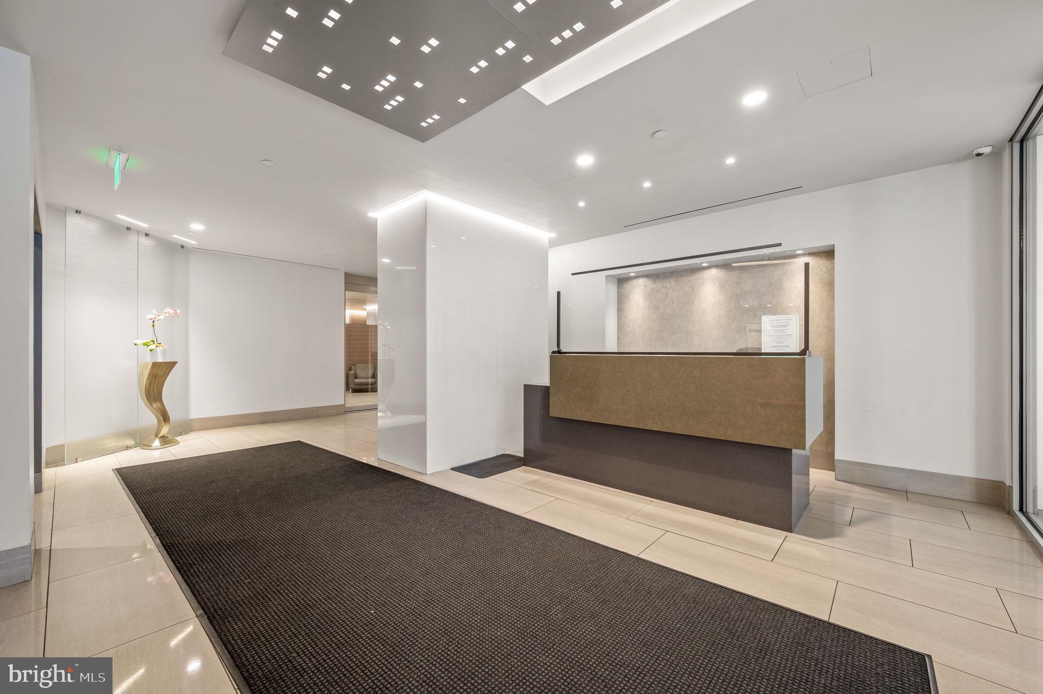 2020 Walnut Street, Unit 29D Philadelphia, PA 19103 - Photo 38 of 40 a view of an empty room with wooden floor and a bathroom