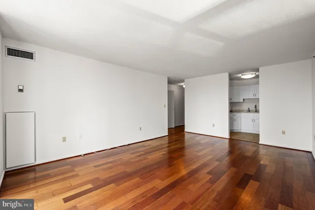 a kitchen with cabinets appliances a sink and a counter top