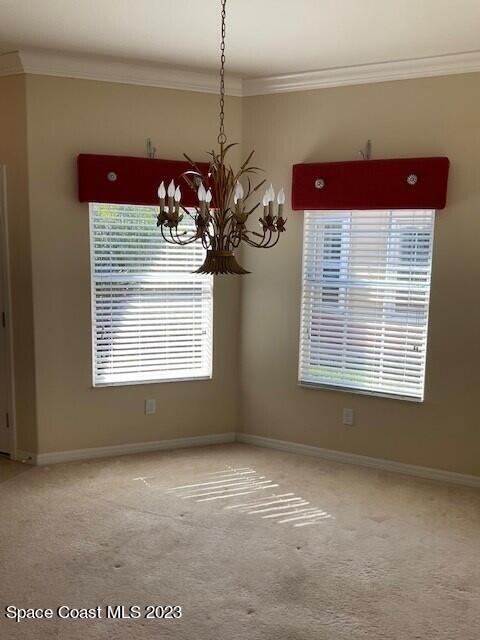 3551 Funston Circle Melbourne, FL 32940 - Photo 11 of 25 a view of a room with window and a chandelier