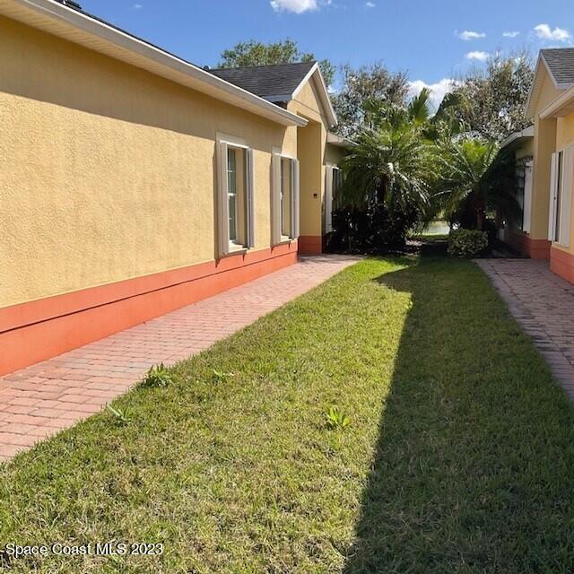 3551 Funston Circle Melbourne, FL 32940 - Photo 2 of 25 a view of a house with a garden