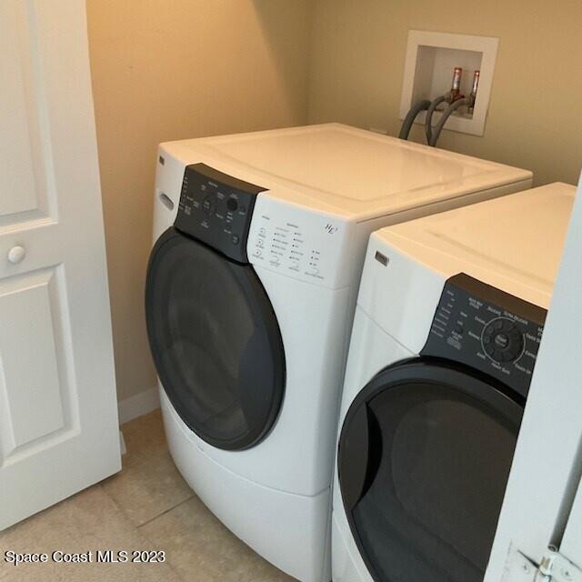 3551 Funston Circle Melbourne, FL 32940 - Photo 24 of 25 a utility room with dryer and washer