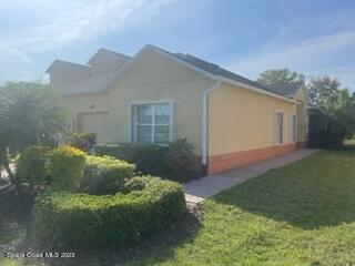 3551 Funston Circle Melbourne, FL 32940 - Photo 3 of 25 a backyard of a house with lots of green space