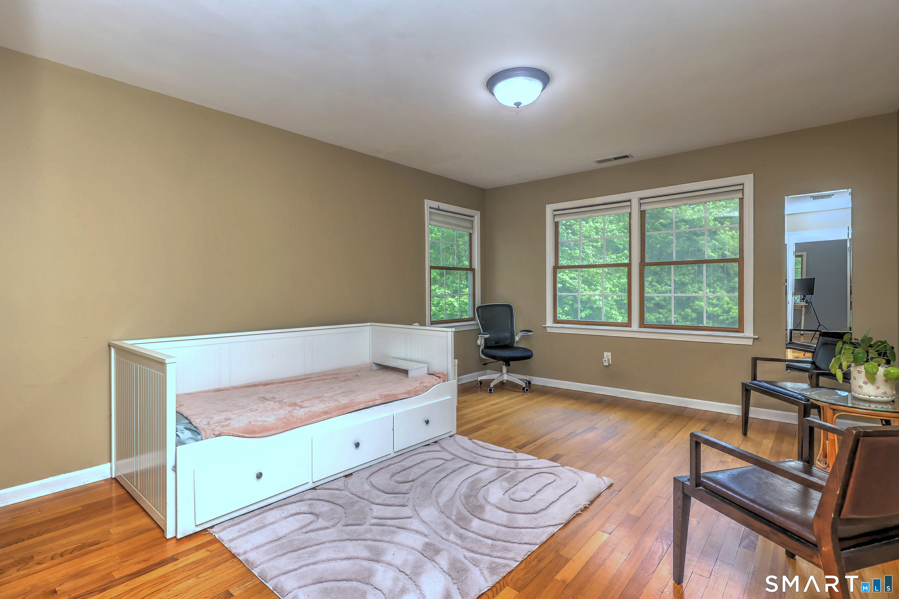 125 Peck Hill Road Woodbridge, CT 06525 - Photo 27 of 40 a living room with furniture and a window