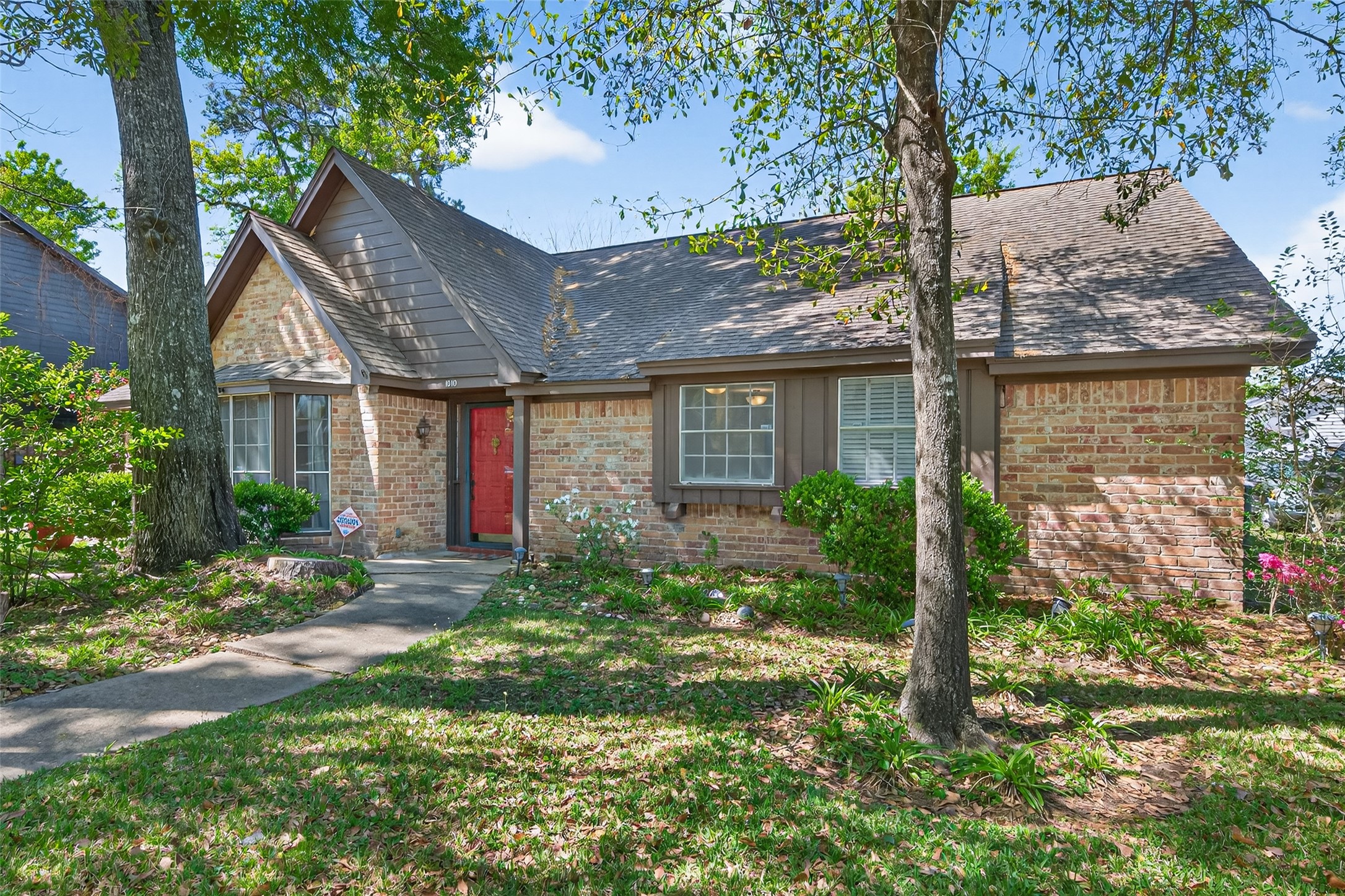 1010 Rhine Lane Houston, TX 77090 - Photo 1 of 30 a front view of a house with garden