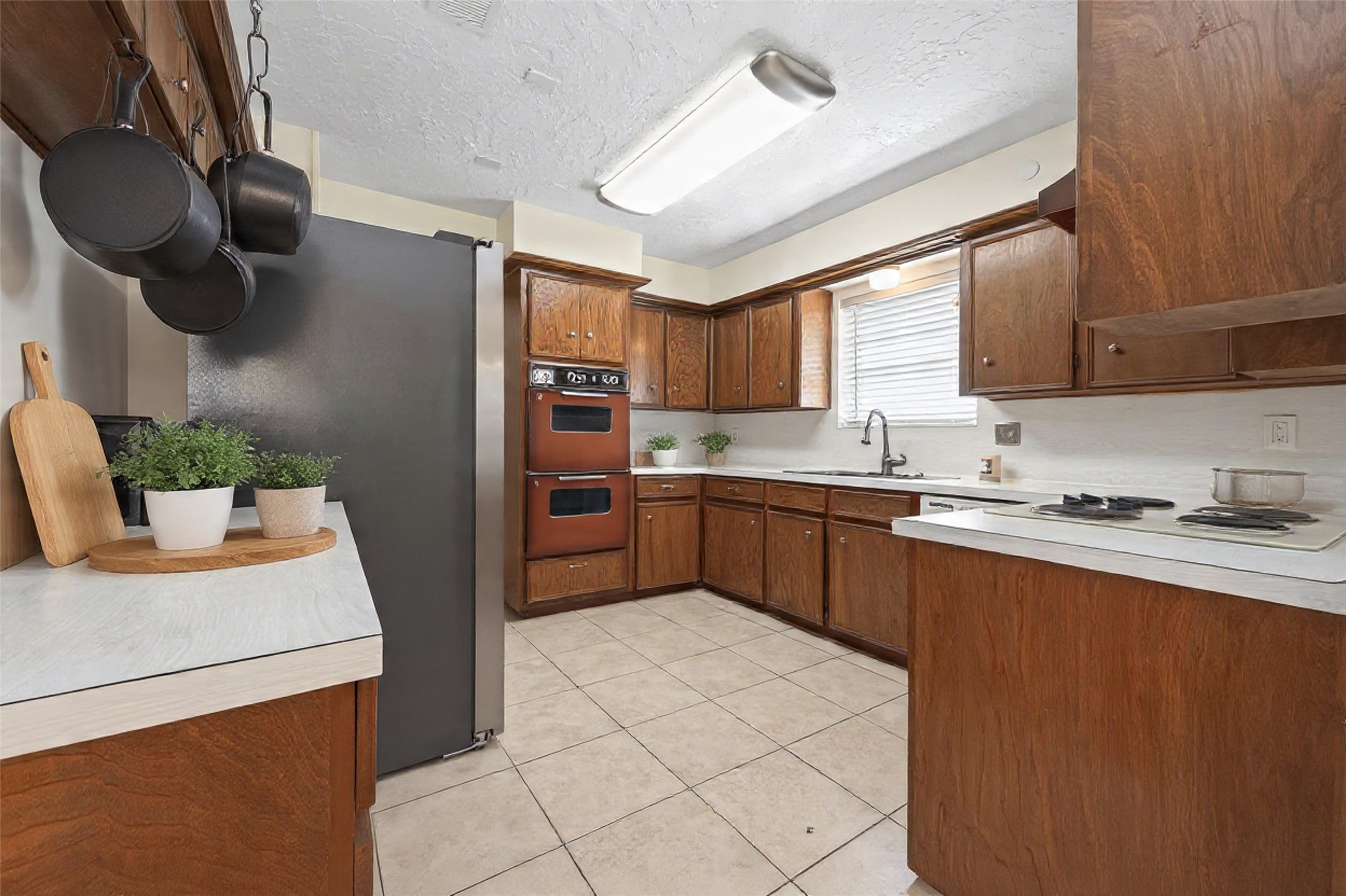1010 Rhine Lane Houston, TX 77090 - Photo 8 of 30 a kitchen with stainless steel appliances granite countertop a sink stove and refrigerator