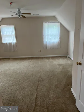 a view of a hallway with staircase
