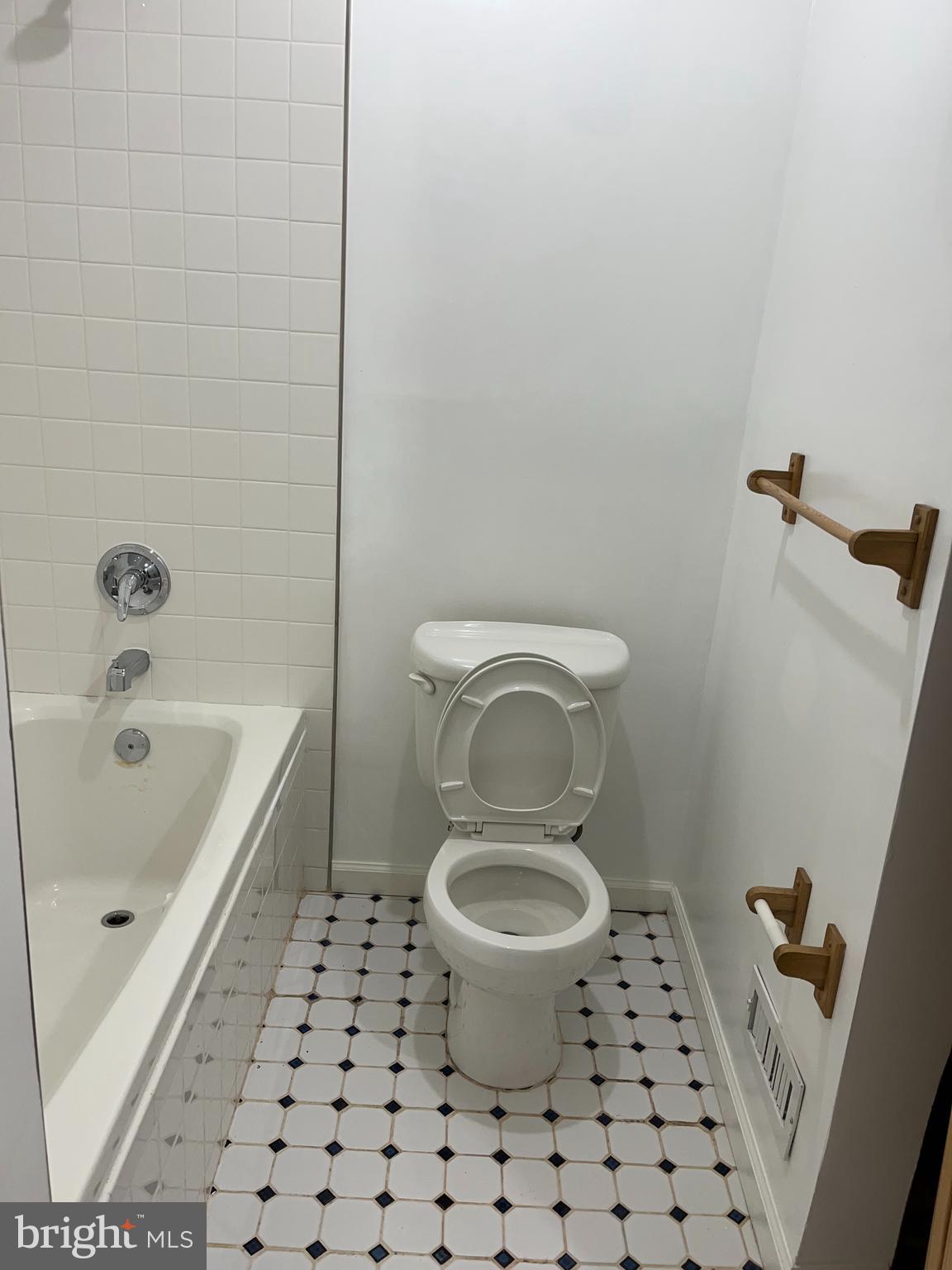 7502 Contee Road Laurel, MD 20707 - Photo 17 of 18 a bathroom with a sink a toilet and a mirror