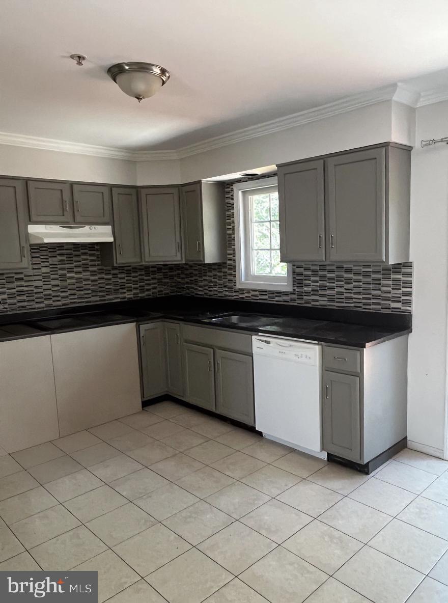 7502 Contee Road Laurel, MD 20707 - Photo 4 of 18 a kitchen with a sink and cabinets