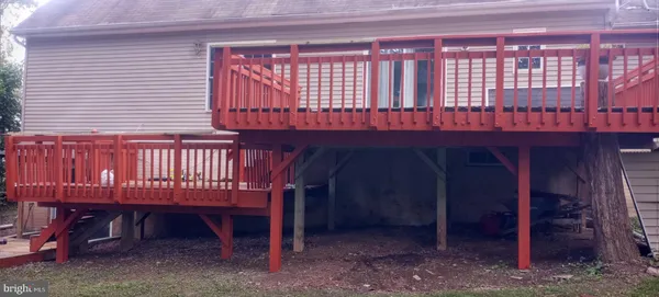 a view of a two chairs in the balcony